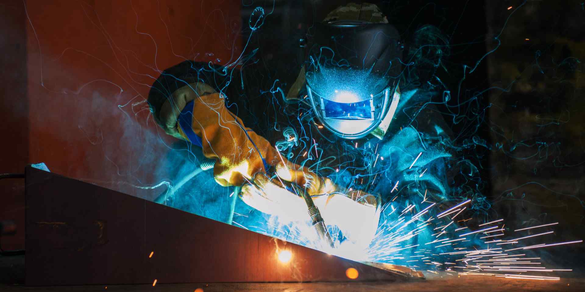 worker welding metal